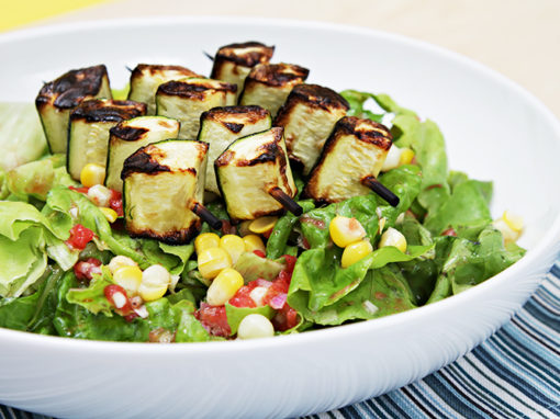 Butter lettuce salad with grilled zucchini skewers and tomato vinaigrette
