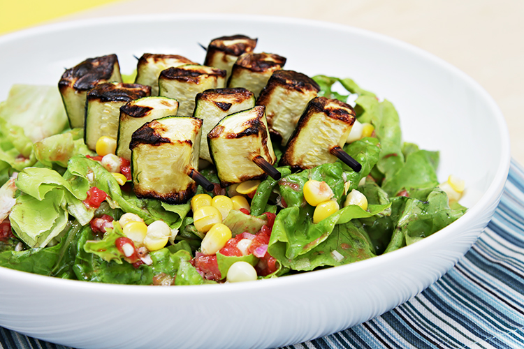 Butter lettuce salad with grilled zucchini skewers and tomato vinaigrette